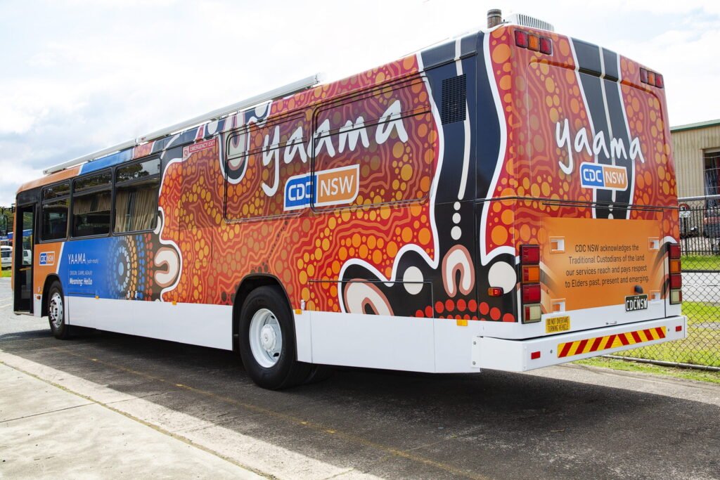 Yaama bus Indigenous art image form behind